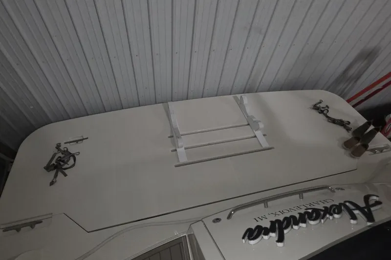 Slide: The Image of 2018 Carver C52 Coupe yacht in storage, featuring deck details and accessories. - 45