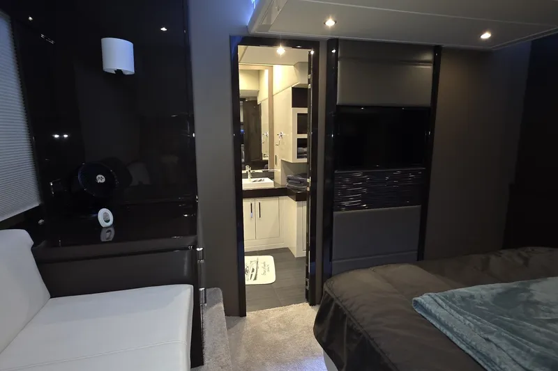 Slide: The Image of Luxurious interior of 2018 Carver C52 Coupe yacht with modern furnishings and ambient lighting. - 43