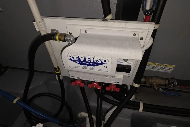 Slide: The Image of Reverso oil change system in 2018 Carver C52 Coupe engine room. - 57