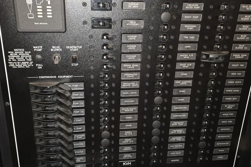 Slide: The Image of Control panel of a 2018 Carver C52 Coupe, featuring switches and labels for various systems. - 51