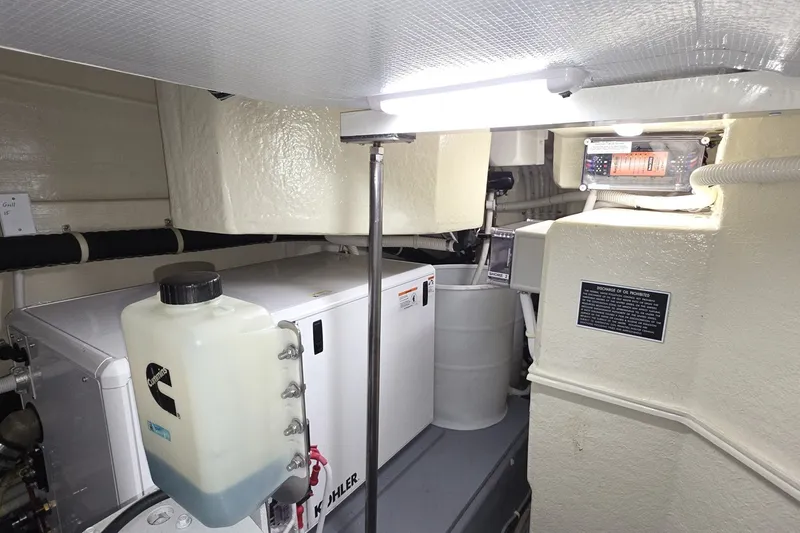 Slide: The Image of Engine room of 2018 Carver C52 Coupe yacht with Kohler generator and Cummins components. - 62