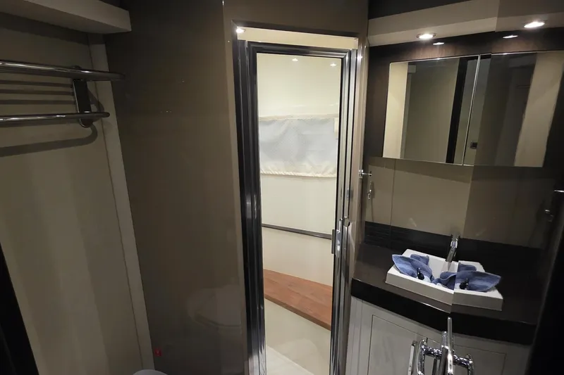 Slide: The Image of Luxurious bathroom interior of 2018 Carver C52 Coupe yacht with modern fixtures. - 32