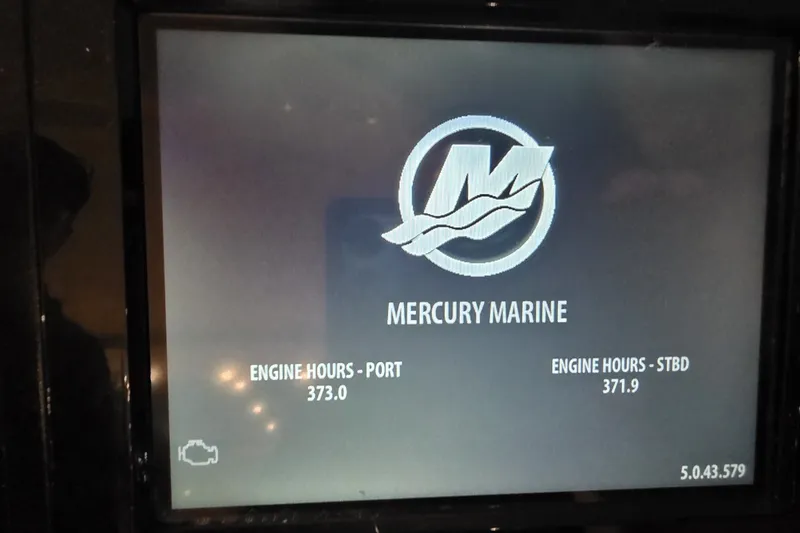 Slide: The Image of Display screen showing Mercury Marine engine hours for Carver C52 Coupe, 2018 model. - 18
