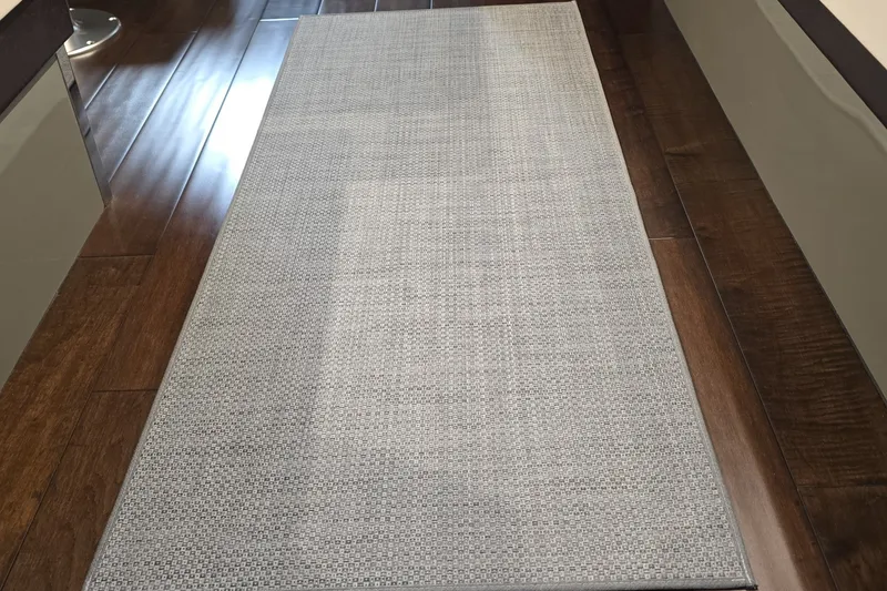 Slide: The Image of Gray carpet runner on wooden floor inside 2018 Carver C52 Coupe yacht. - 35