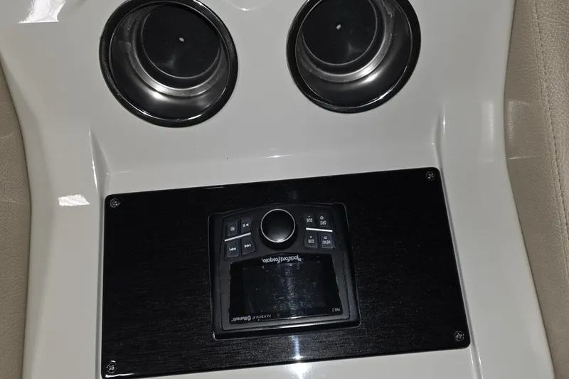 Slide: The Image of Control panel and cup holders in 2018 Carver C52 Coupe interior. - 23