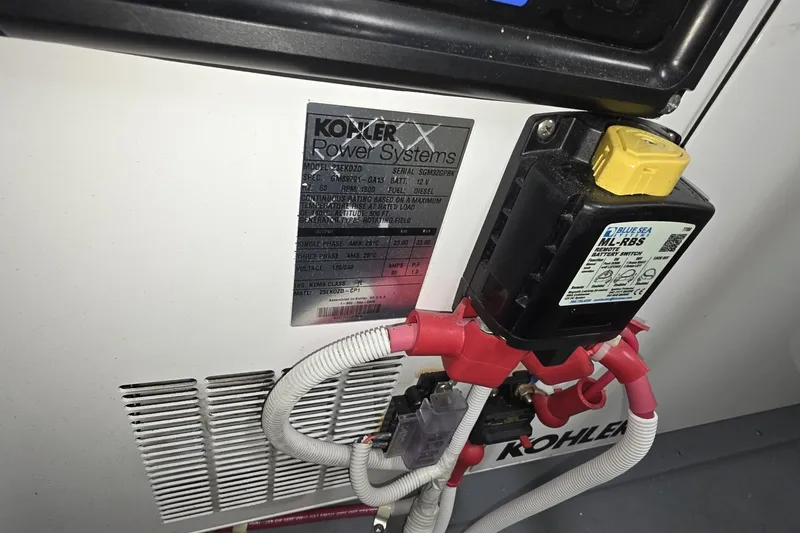 Slide: The Image of Kohler power system with Blue Sea battery switch in Carver C52 Coupe, 2018 model. - 40