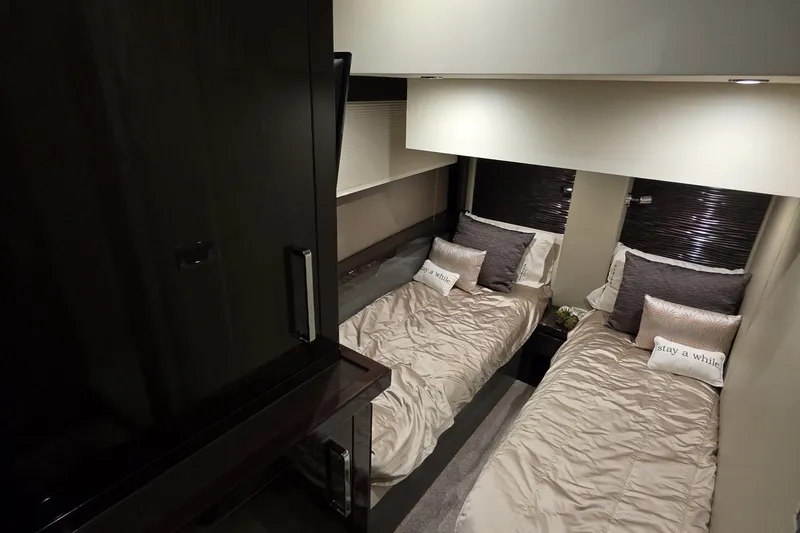 Slide: The Image of Luxurious twin bedroom in 2018 Carver C52 Coupe yacht, featuring elegant bedding and modern decor. - 30