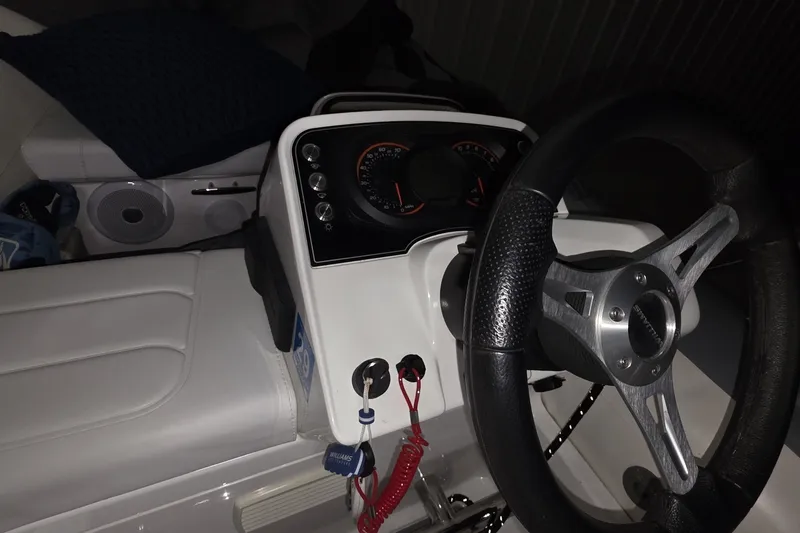 Slide: The Image of Steering wheel and dashboard of 2018 Carver C52 Coupe boat interior. - 65