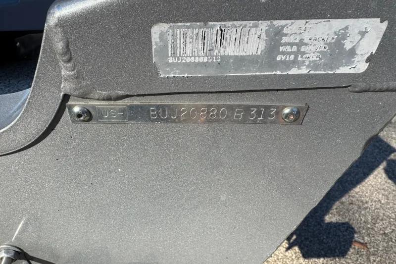 Slide: The Image of 2013 Tracker Super Guide V-16 DLX T boat identification plate with serial number. - 17
