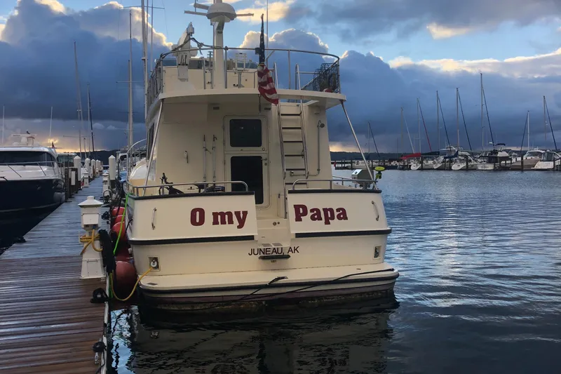 Slide: The Image of Nordic Tug 52 boat named "O my Papa" docked at marina, 2003 model. - 20