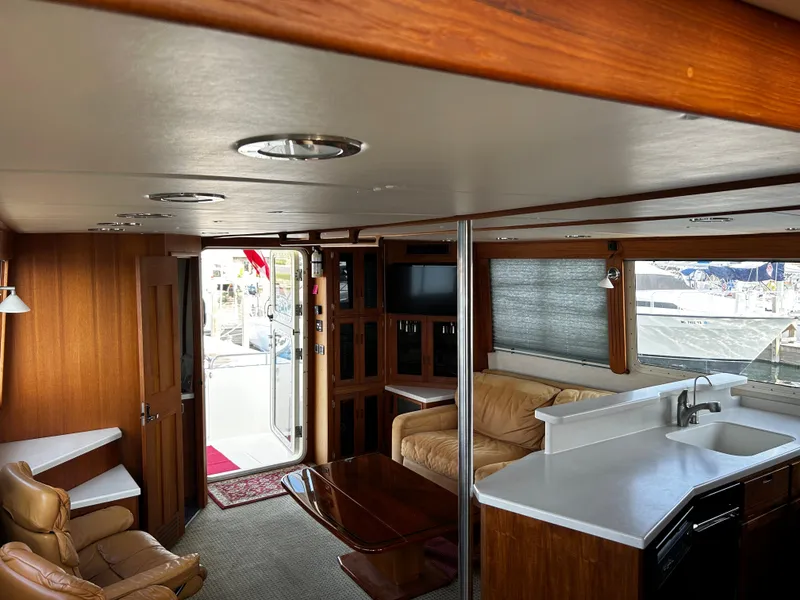Slide: The Image of Interior of 2003 Nordic Tug 52 yacht with cozy seating and modern amenities. - 38