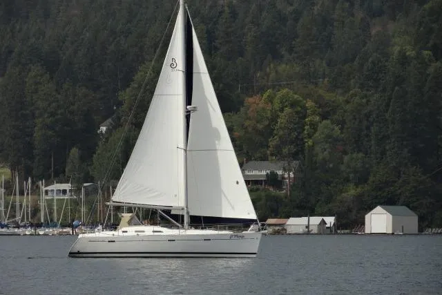 The Image of Sailing yacht Beneteau 393, 2007 model, gliding on a serene lake with forested backdrop. - 0