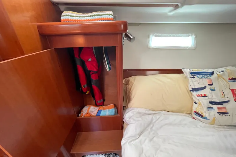 Slide: The Image of Cozy aft cabin interior of 2007 Beneteau 393 sailboat with bed and storage - 16