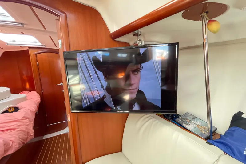 Slide: The Image of Interior of 2007 Beneteau 393 yacht with TV and cozy seating area - 17