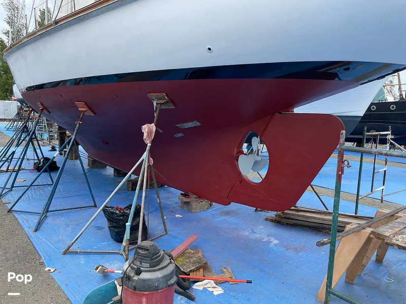 Slide: The Image of New bottom paint Aug 2021.  Prepping for coat 2 above waterline. - 9317789