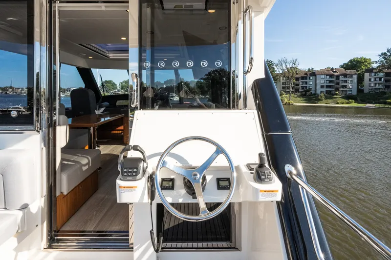 Slide: The Image of Riviera 57 Enclosed Flybridge 2023 - 58