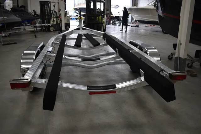 Slide: The Image of Yacht Club Trailers 25-7000 Aluminum Tandem Axle Bunk boat trailer 2026 - 5