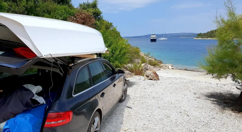 Slide: The Image of Beneteau First 14 SE On top of the car - 1696115