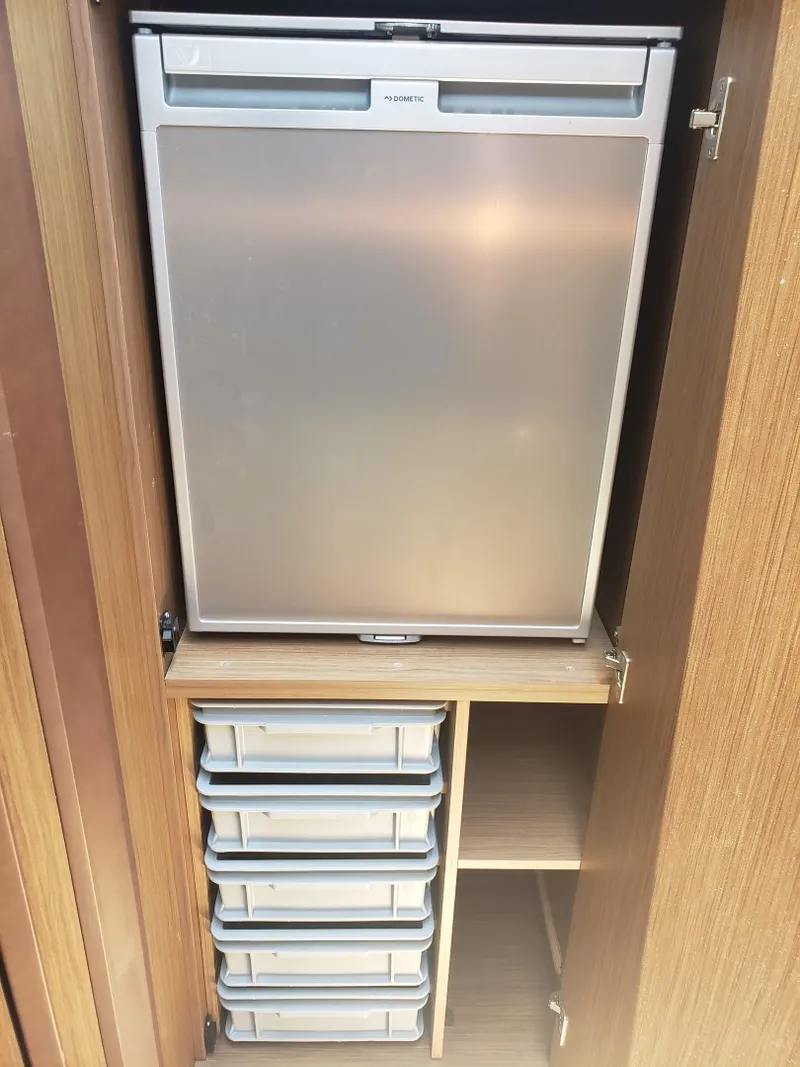 Slide: The Image of 2019 33 Jeanneau Express - Companion Way Fridge - 1692191