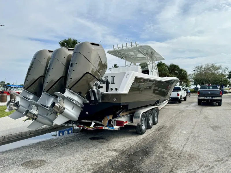 Slide: The Image of Outboard Engines on the 2014 42' Invincible CaryAli on a trailer - 5132904