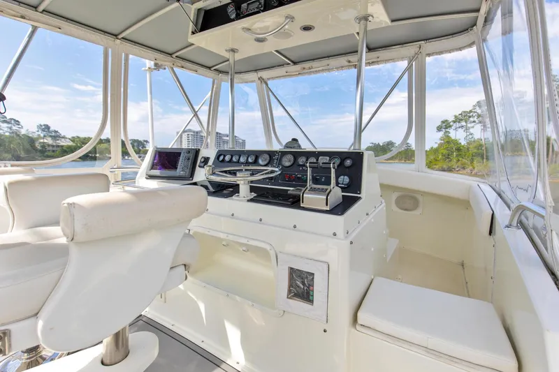 Slide: The Image of 1981 Bertram 42 Convertible Balls To The Wall Flybridge Helm - 3686916