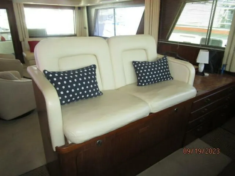 Slide: The Image of 63' Hatteras lower helm benchseat - 3904592