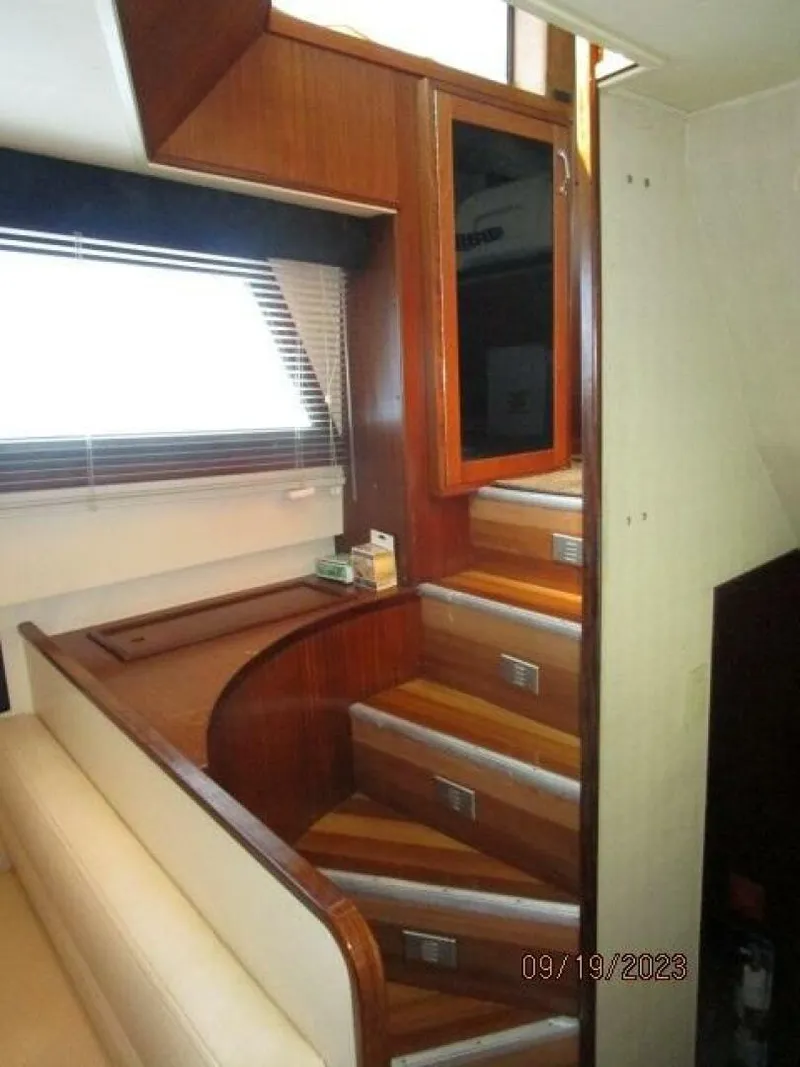 Slide: The Image of 63' Hatteras salon-galley stairs - 3904617