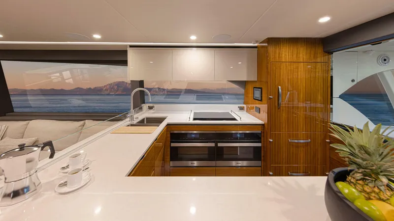 Slide: The Image of Riviera 78 Motor Yacht Galley 01 Gloss Teak Timber Finish - 3944811