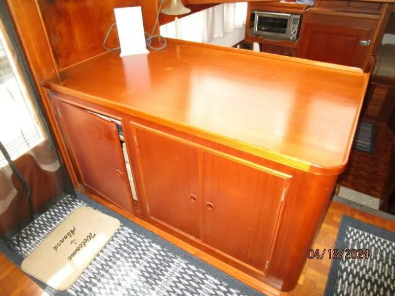 Slide: The Image of 46' Grand Bank salon port forward cabinetry - 4316017
