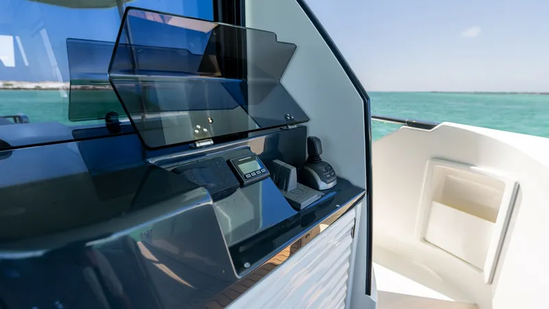 Slide: The Image of Flybridge Helm Station The helm station on the 2027 Absolute 60 Flybridge offers a sleek, modern design with advanced navigation technology. The glass displays and ergonomic controls ensure a smooth and intuitive boating experience. Positioned for optimal visibility, this helm - 6492516