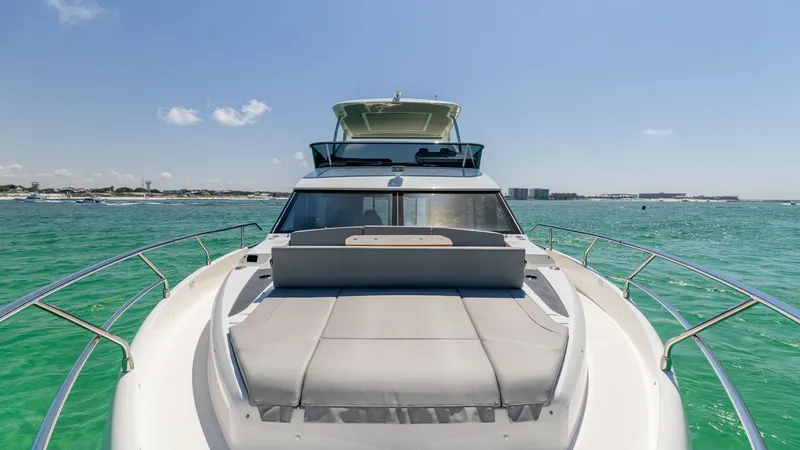 Slide: The Image of Bow Lounge Area with Sun Pads The bow of the 2027 60 Absolute Flybridge features a spacious lounge area equipped with luxurious sun pads, perfect for soaking up the sun while cruising. The sleek design is complemented by stainless steel railings and panoramic views of the surrounding - 6492519