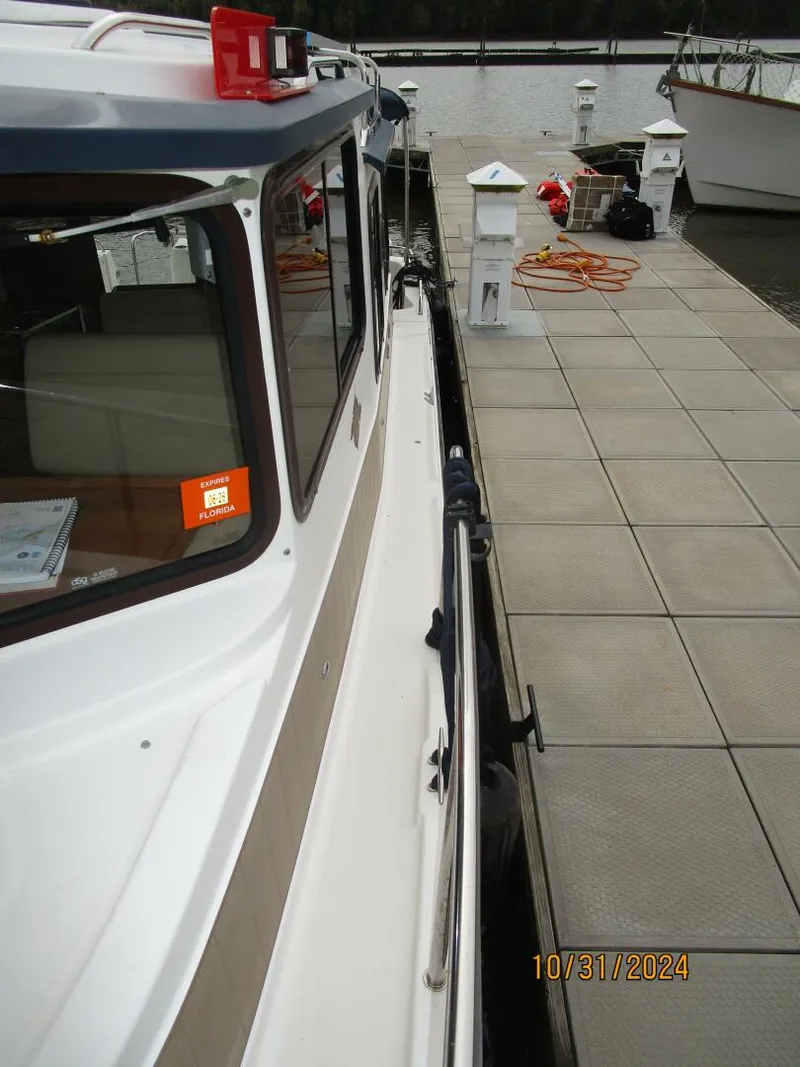 Slide: The Image of 29' Ranger Tugs port side deck2 - 4776137