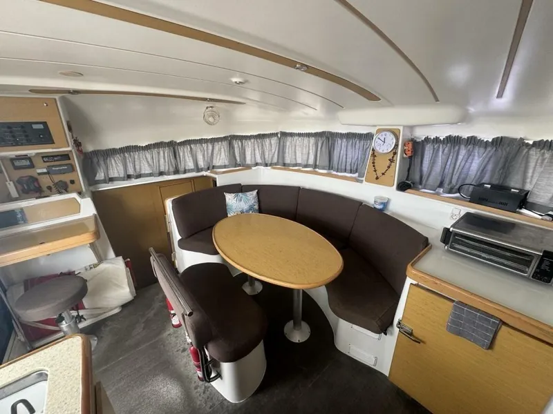 Slide: The Image of 2013 Lagoon 380 S2 - Owner Version This boat is the popular S2, 3 cabin owners' version. The cockpit is protected by a fiberglass hard top with sliding panel over the helm position to allow the skipper excellent visibility of the boat. The boat has new antifoul paint (May 2023), new zincs, - 4791933