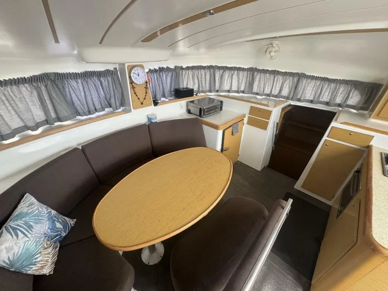 Slide: The Image of 2013 Lagoon 380 S2 - Owner Version This boat is the popular S2, 3 cabin owners' version. The cockpit is protected by a fiberglass hard top with sliding panel over the helm position to allow the skipper excellent visibility of the boat. The boat has new antifoul paint (May 2023), new zincs, - 4791934