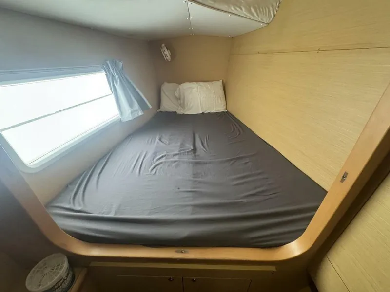 Slide: The Image of 2013 Lagoon 380 S2 - Owner Version This boat is the popular S2, 3 cabin owners' version. The cockpit is protected by a fiberglass hard top with sliding panel over the helm position to allow the skipper excellent visibility of the boat. The boat has new antifoul paint (May 2023), new zincs, - 4791927