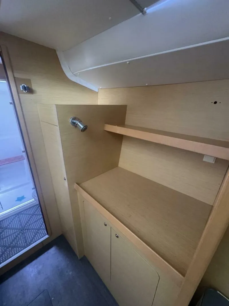 Slide: The Image of 2013 Lagoon 380 S2 - Owner Version This boat is the popular S2, 3 cabin owners' version. The cockpit is protected by a fiberglass hard top with sliding panel over the helm position to allow the skipper excellent visibility of the boat. The boat has new antifoul paint (May 2023), new zincs, - 4791976