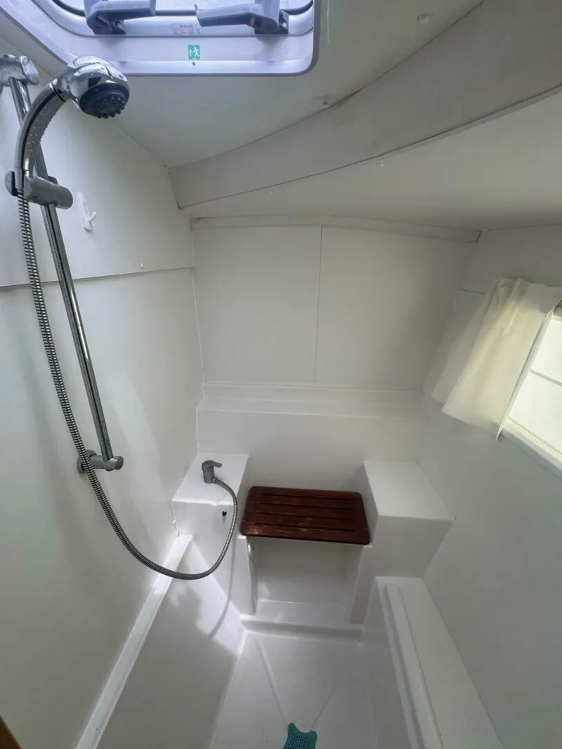 Slide: The Image of 2013 Lagoon 380 S2 - Owner Version This boat is the popular S2, 3 cabin owners' version. The cockpit is protected by a fiberglass hard top with sliding panel over the helm position to allow the skipper excellent visibility of the boat. The boat has new antifoul paint (May 2023), new zincs, - 4791978