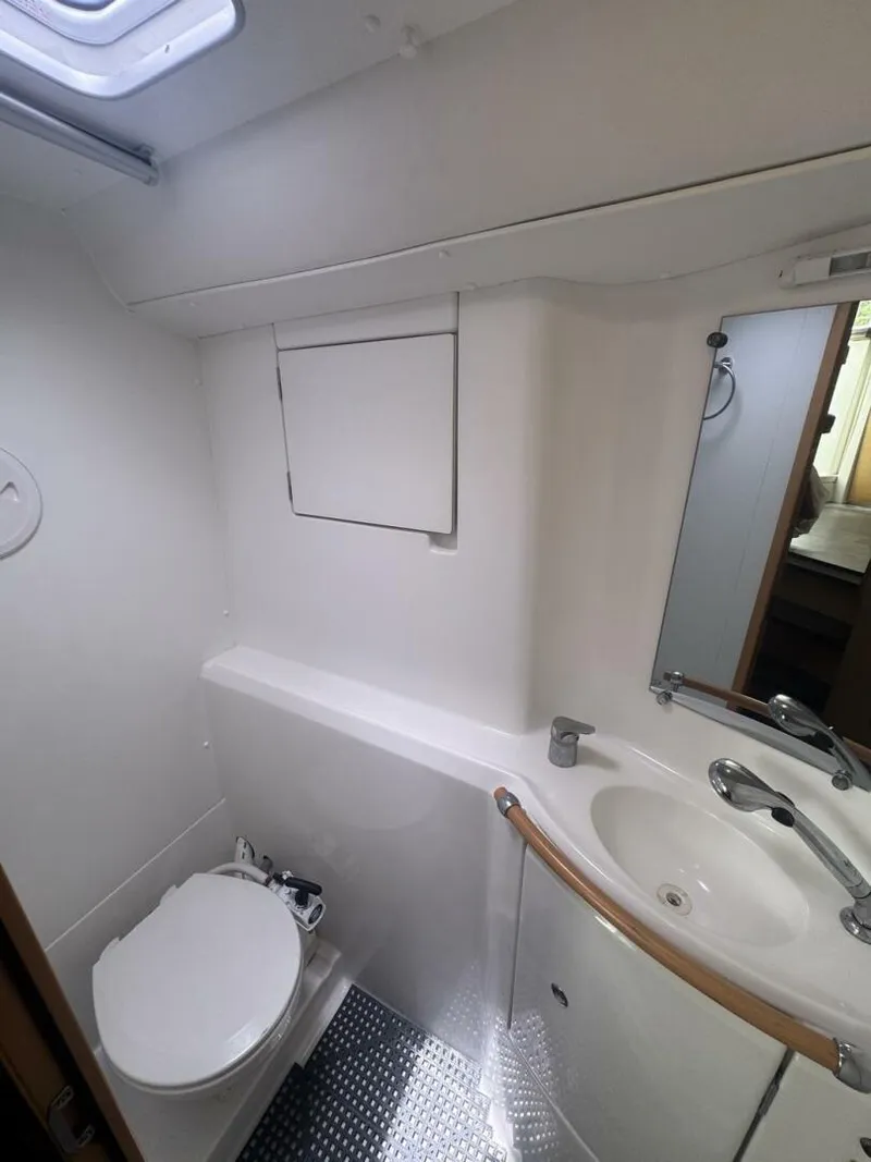 Slide: The Image of 2013 Lagoon 380 S2 - Owner Version This boat is the popular S2, 3 cabin owners' version. The cockpit is protected by a fiberglass hard top with sliding panel over the helm position to allow the skipper excellent visibility of the boat. The boat has new antifoul paint (May 2023), new zincs, - 4791980