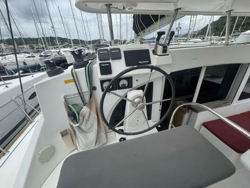 Slide: The Image of 2013 Lagoon 380 S2 - Owner Version This boat is the popular S2, 3 cabin owners' version. The cockpit is protected by a fiberglass hard top with sliding panel over the helm position to allow the skipper excellent visibility of the boat. The boat has new antifoul paint (May 2023), new zincs, - 4791936