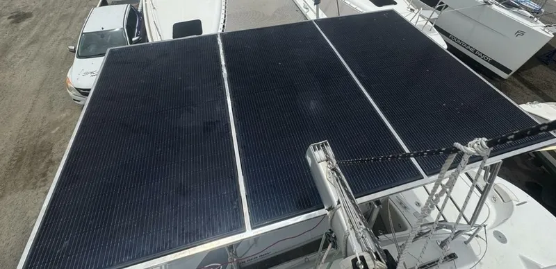 Slide: The Image of 2013 Lagoon 380 S2 - Owner Version This boat is the popular S2, 3 cabin owners' version. The cockpit is protected by a fiberglass hard top with sliding panel over the helm position to allow the skipper excellent visibility of the boat. The boat has new antifoul paint (May 2023), new zincs, - 4791918