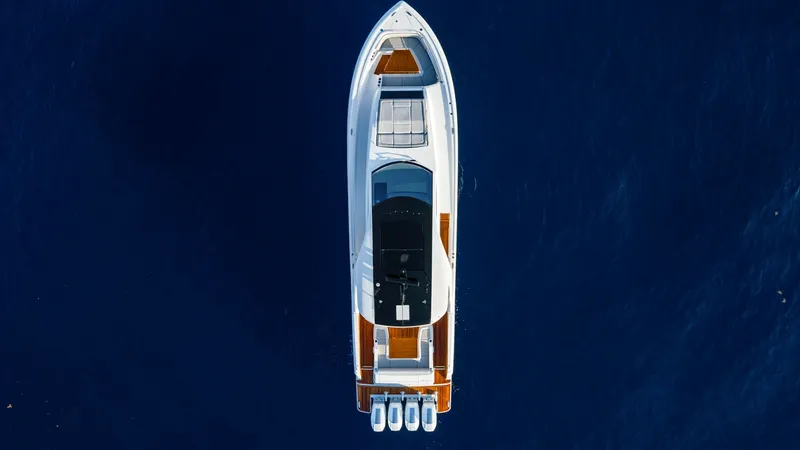Slide: The Image of Aerial View of Deck Layout - Valhalla 55 Sport Yacht This overhead shot of the 2027 Valhalla Boatworks 55 SY showcases its sleek and modern deck design. The vessel boasts a spacious bow seating area, perfect for relaxation. The four powerful outboard engines promise exceptional performance, while the elegan - 6332942