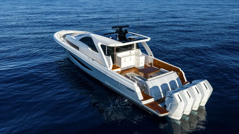 Slide: The Image of Aft Deck and Quad Engine View - Valhalla 55 Sport Yacht The NEW Valhalla Boatworks 55 SY showcases its striking aft deck, featuring a spacious layout with elegant teak finishes. Equipped with four powerful outboard engines, this vessel promises exceptional performance and speed. The sleek design and ample seat - 6332948