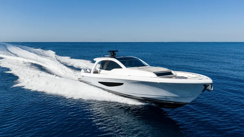 Slide: The Image of Dynamic Bow Exterior View -Valhalla 55 Sport Yacht The Valhalla Boatworks 55 SY cuts through the water with precision, showcasing its sleek bow design. The vessel's aerodynamic shape and pristine white finish highlight its modern engineering and elegance. Perfect for high-speed cruising, this model offers - 6332949
