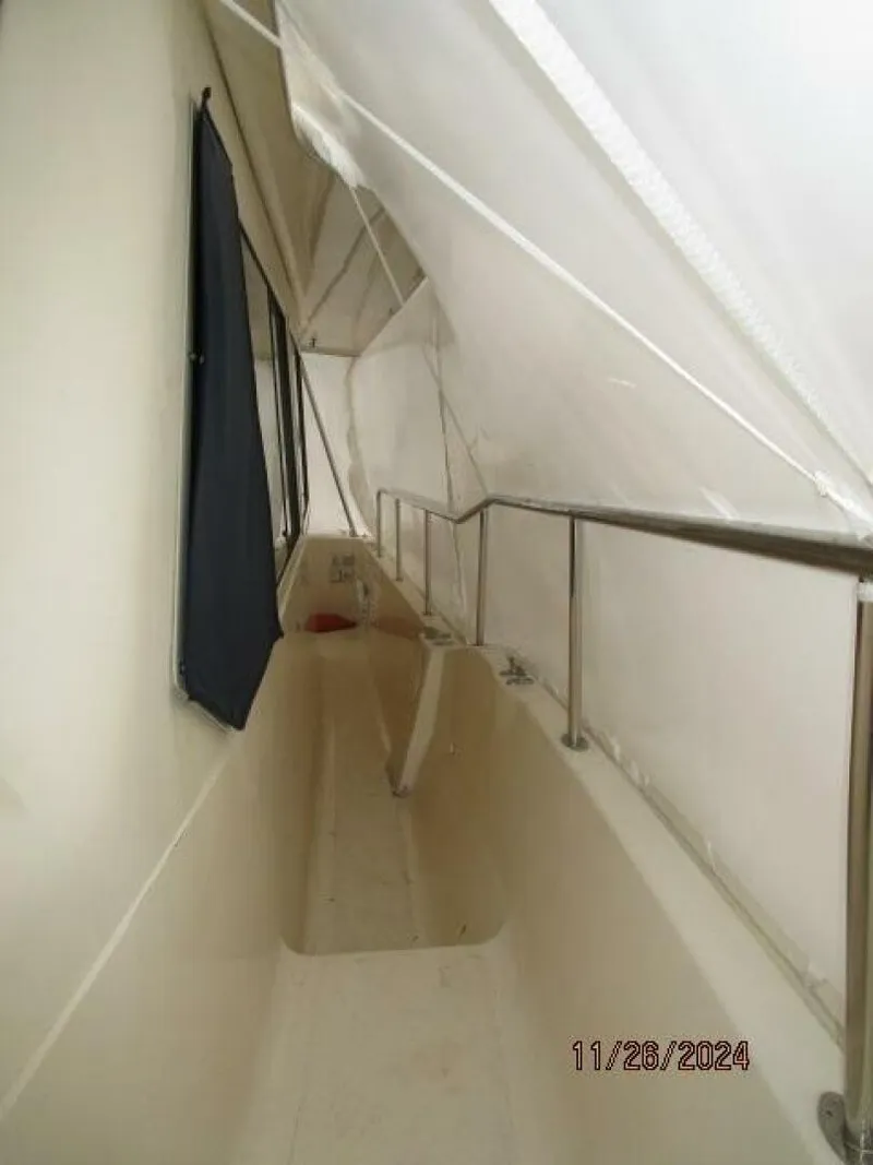 Slide: The Image of 34' Mainship port side deck2 - 4856832