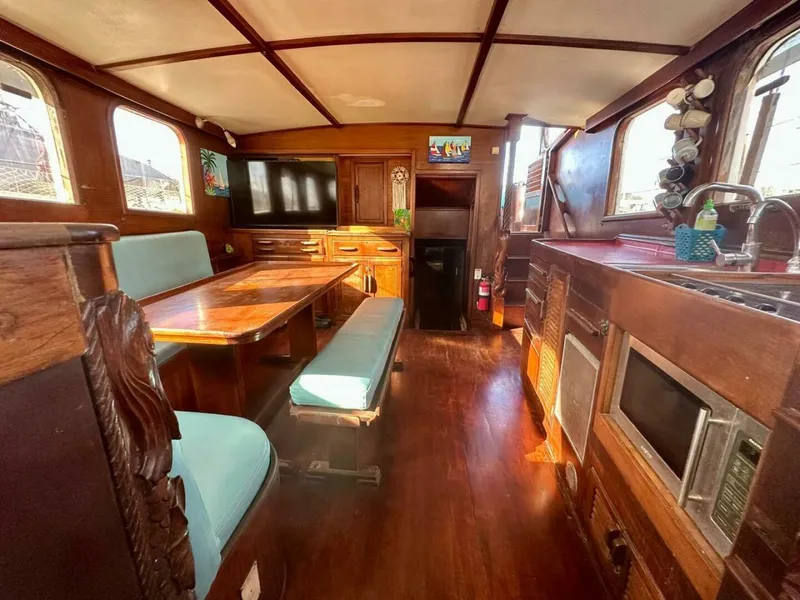 Slide: The Image of 72 ft Custom 1978 Don Brooke Ketch/Motorsailer MONSOON Monsoon is a 1978 large ocean-going cruising ketch that was professionally designed and built and is well equipped for the most demanding of open ocean voyages and has made three Pacific Ocean crossings.  

She carries all furling sails, a 185 horsepower  - 4863268