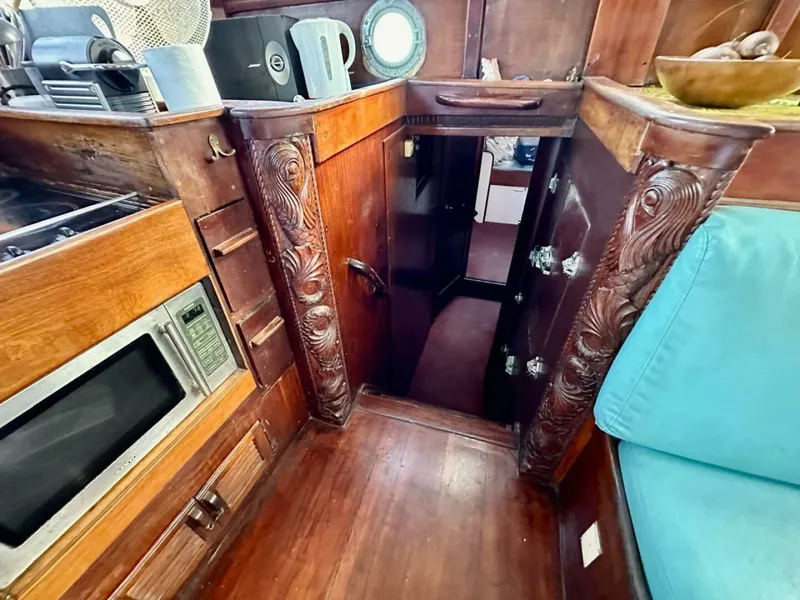 Slide: The Image of 72 ft Custom 1978 Don Brooke Ketch/Motorsailer MONSOON Monsoon is a 1978 large ocean-going cruising ketch that was professionally designed and built and is well equipped for the most demanding of open ocean voyages and has made three Pacific Ocean crossings.  

She carries all furling sails, a 185 horsepower  - 4863274