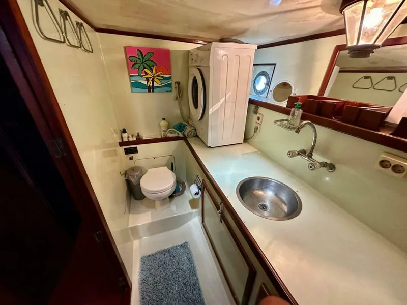 Slide: The Image of 72 ft Custom 1978 Don Brooke Ketch/Motorsailer MONSOON Monsoon is a 1978 large ocean-going cruising ketch that was professionally designed and built and is well equipped for the most demanding of open ocean voyages and has made three Pacific Ocean crossings.  

She carries all furling sails, a 185 horsepower  - 4863272