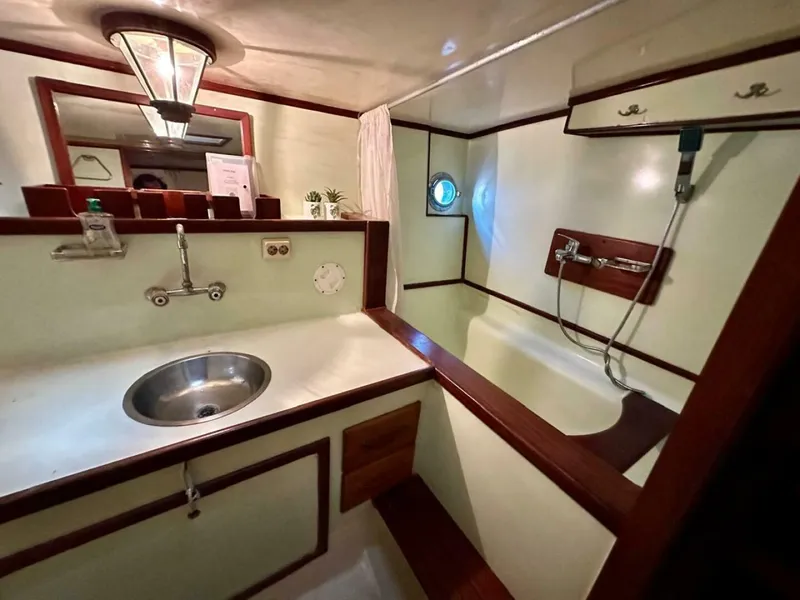 Slide: The Image of 72 ft Custom 1978 Don Brooke Ketch/Motorsailer MONSOON Monsoon is a 1978 large ocean-going cruising ketch that was professionally designed and built and is well equipped for the most demanding of open ocean voyages and has made three Pacific Ocean crossings.  

She carries all furling sails, a 185 horsepower  - 4863271