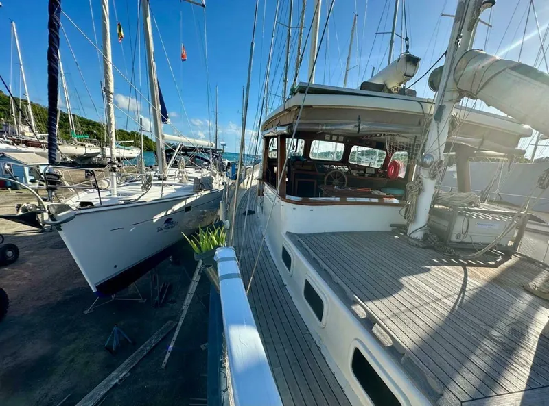 Slide: The Image of 72 ft Custom 1978 Don Brooke Ketch/Motorsailer MONSOON Monsoon is a 1978 large ocean-going cruising ketch that was professionally designed and built and is well equipped for the most demanding of open ocean voyages and has made three Pacific Ocean crossings.  

She carries all furling sails, a 185 horsepower  - 4863258