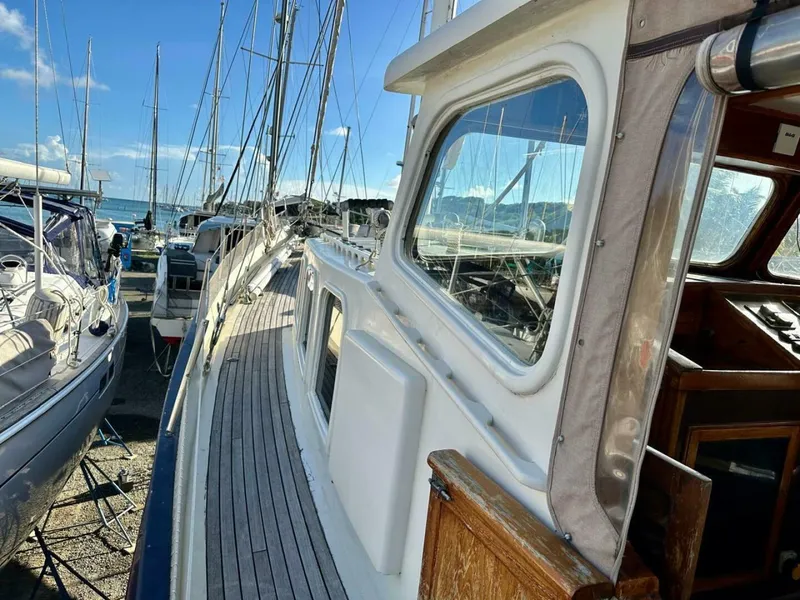 Slide: The Image of 72 ft Custom 1978 Don Brooke Ketch/Motorsailer MONSOON Monsoon is a 1978 large ocean-going cruising ketch that was professionally designed and built and is well equipped for the most demanding of open ocean voyages and has made three Pacific Ocean crossings.  

She carries all furling sails, a 185 horsepower  - 4863283